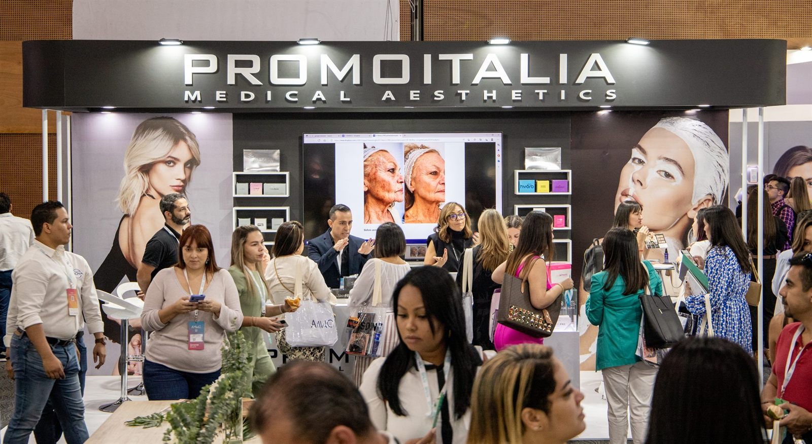 A busy custom exhibition stand drawing a crowd at a trade show